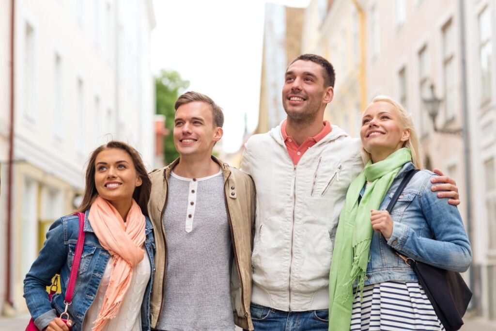 Travelers who became friends walking through a city
