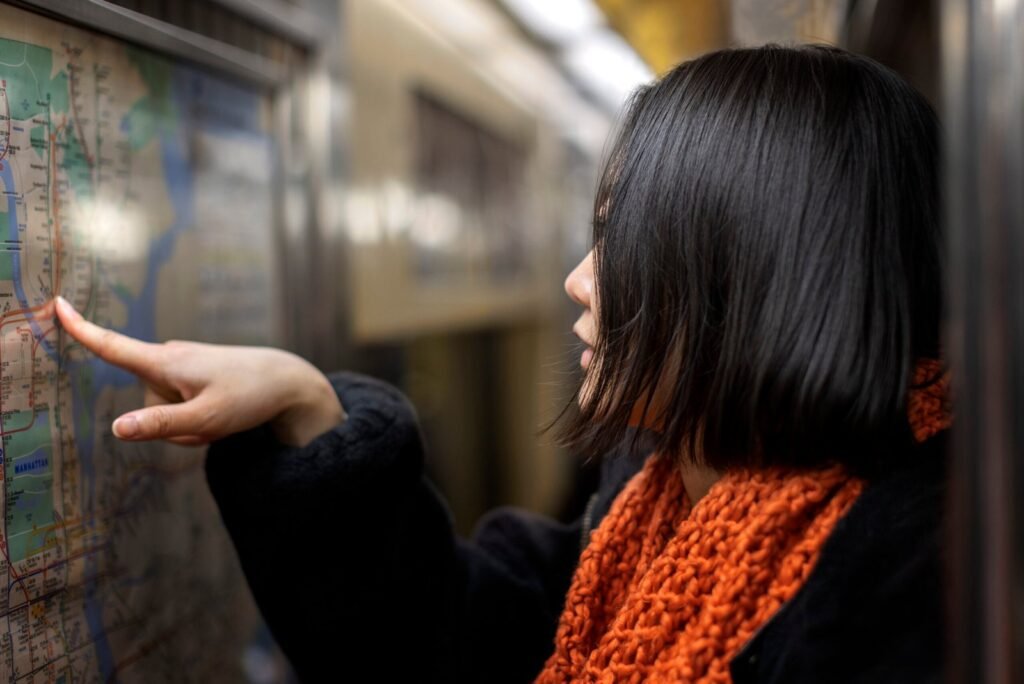 Woman checking map on the New York City subway