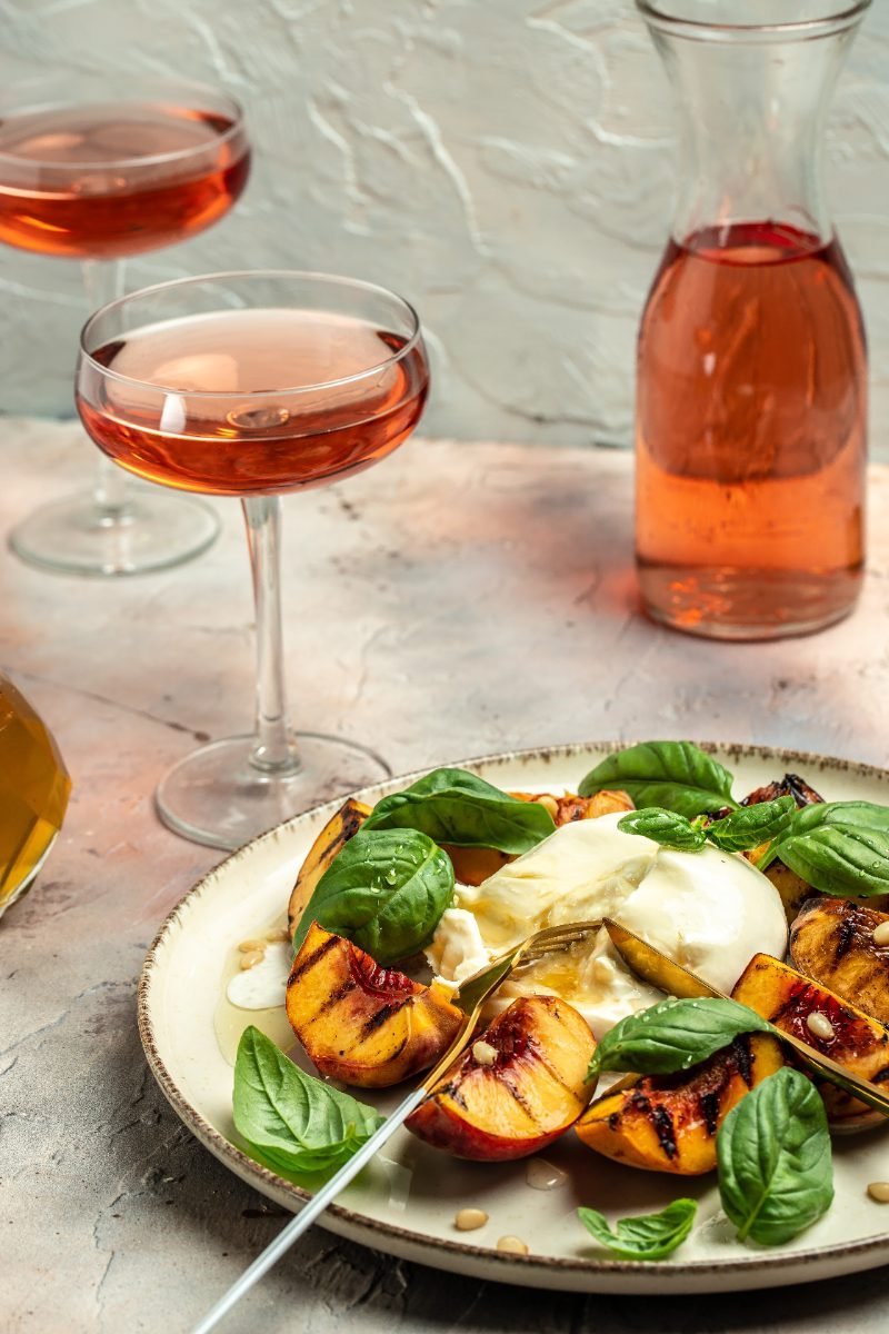 Burrata cheese with grilled peaches and rose wine