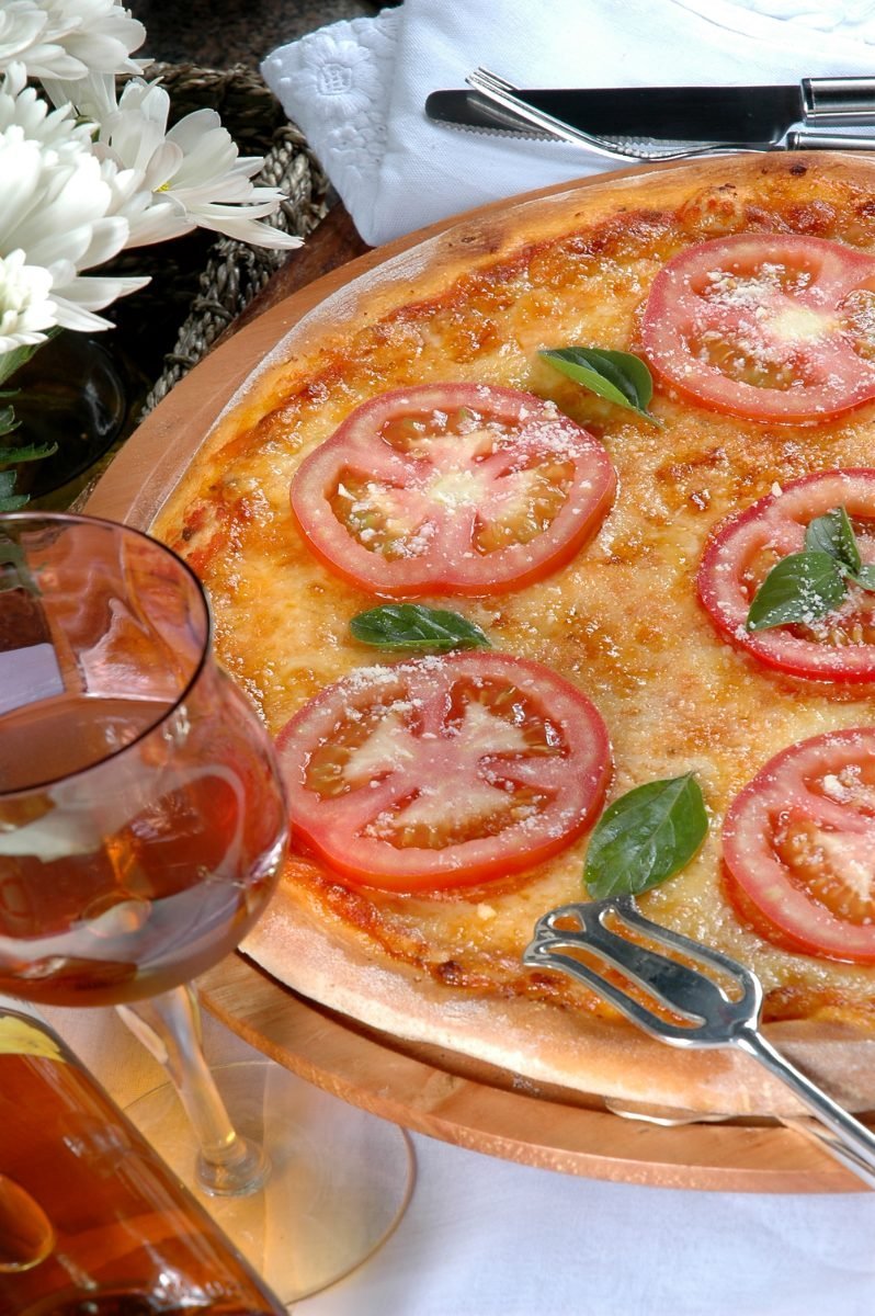 Pizza Margherita with tomatoes and mozzarella