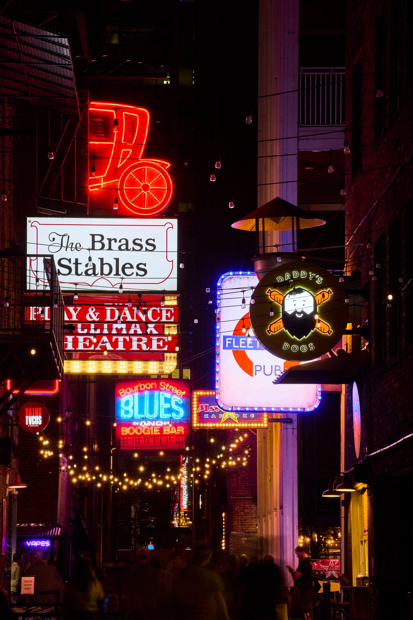 Vibrant neon lights and nightlife on Sixth Street in Austin Texas
