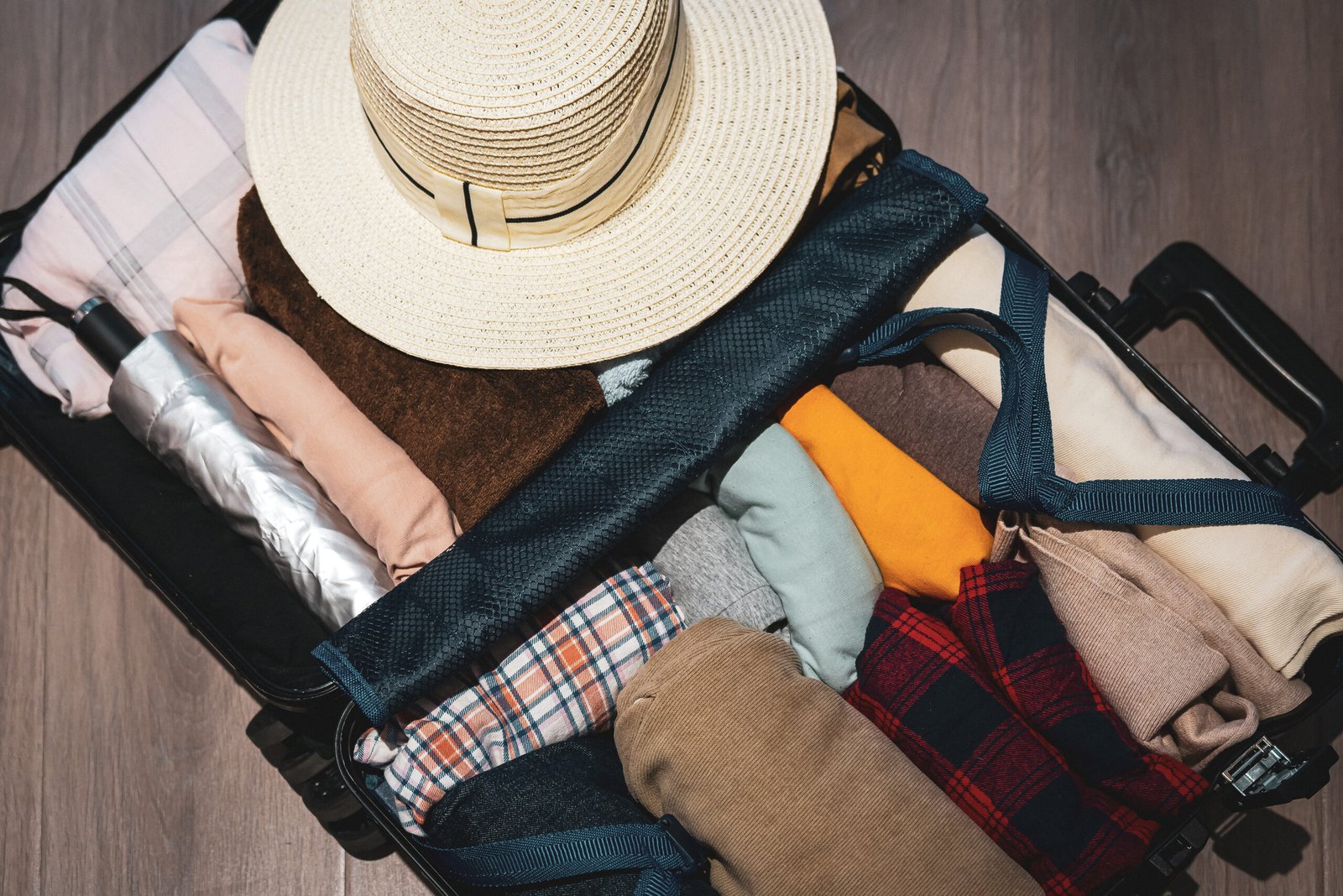 Organized travel essentials in stylish suitcase packed for adventure
