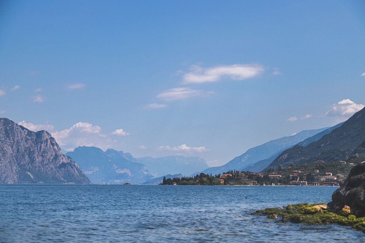 A boat on Lake Como with mountains behind