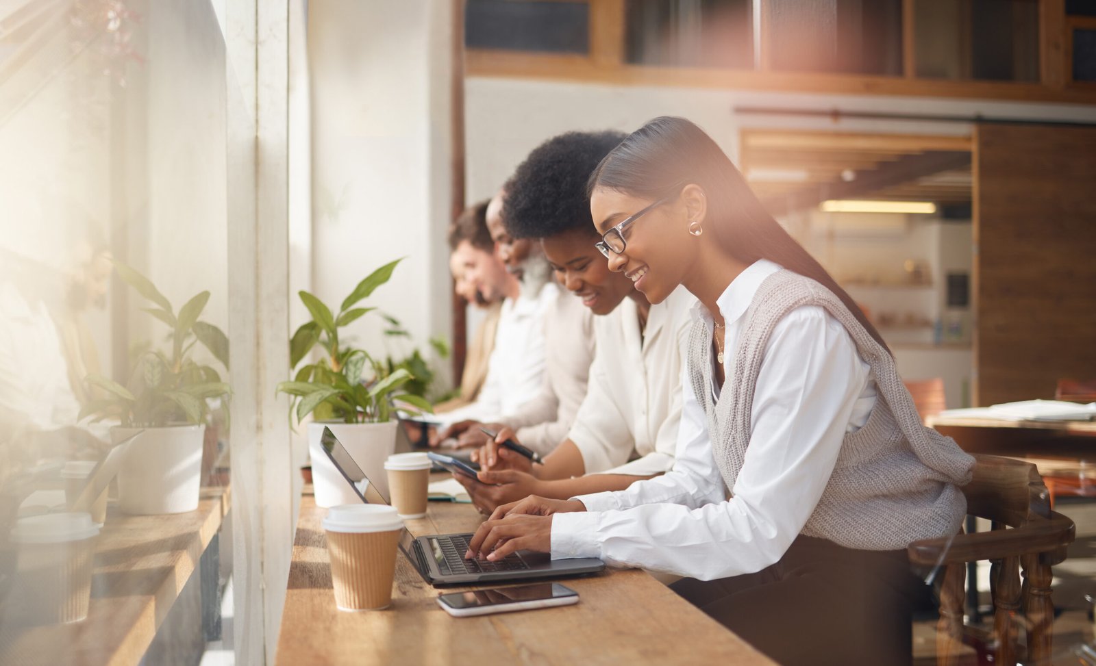 Coworking space with people working on laptops together