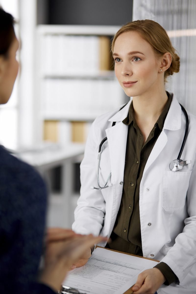 A doctor talking with a patient in a clinic