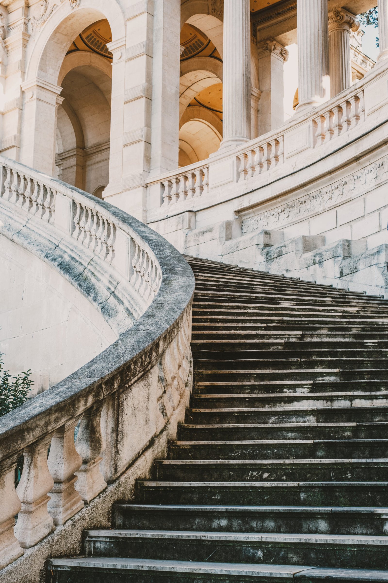 Elegant stone staircase leading to historic architecture