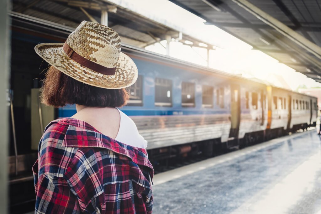 Woman waiting for a train at a European train station