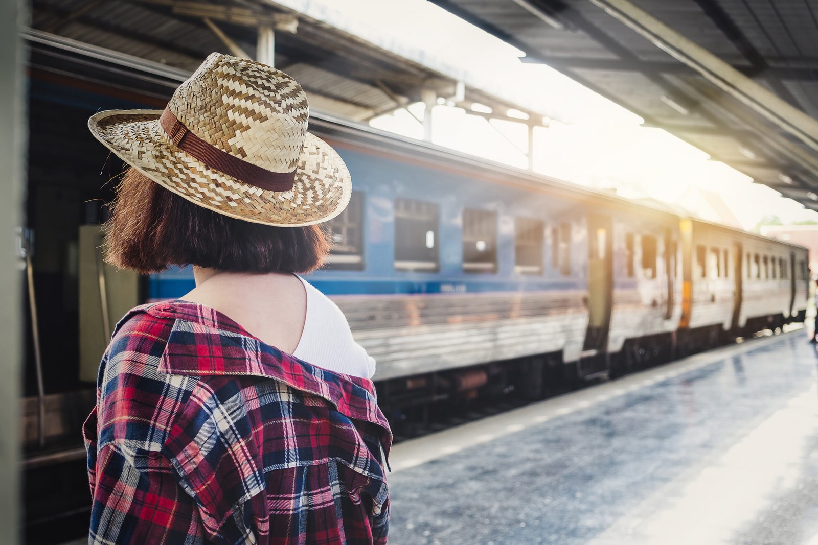 Woman waiting for a train at a European train station