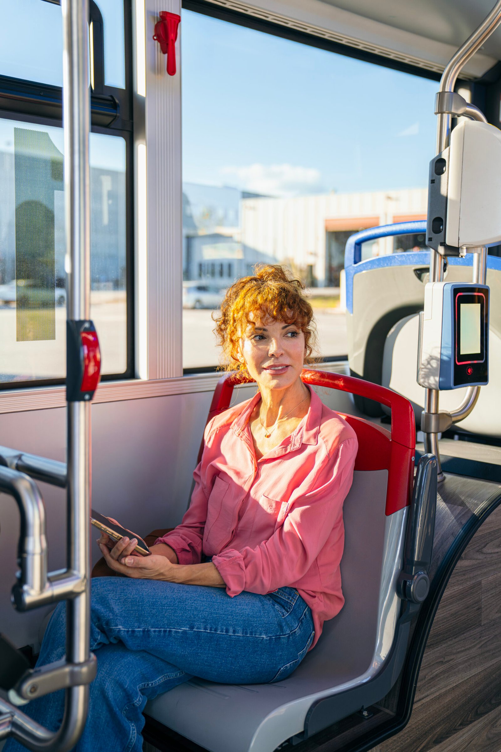 Woman commuting by public city bus transport in Miami