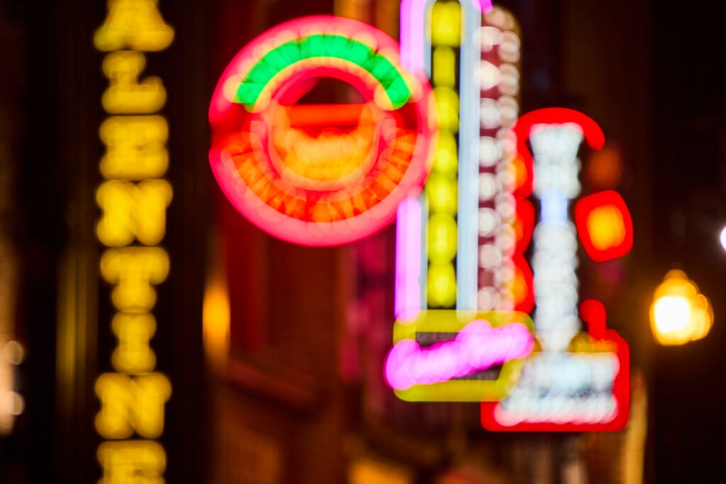 Neon lights along Broadway honky-tonks in Nashville at night