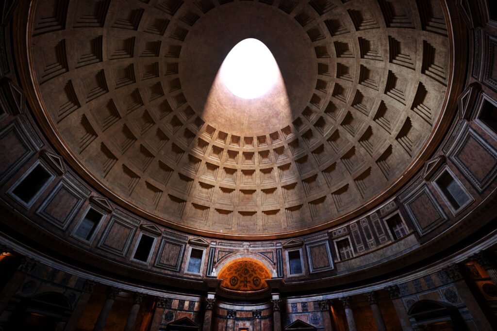 Inside the Pantheon Rome light shining through oculus ceiling