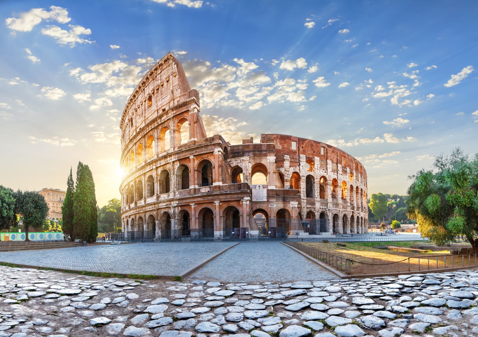 The Colosseum in Rome bathed in morning sun rays