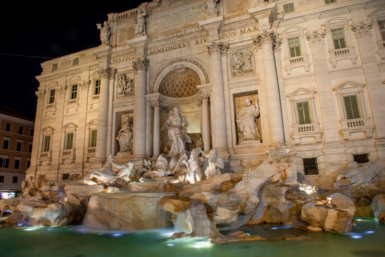 The Trevi Fountain illuminated at night in Rome, Italy