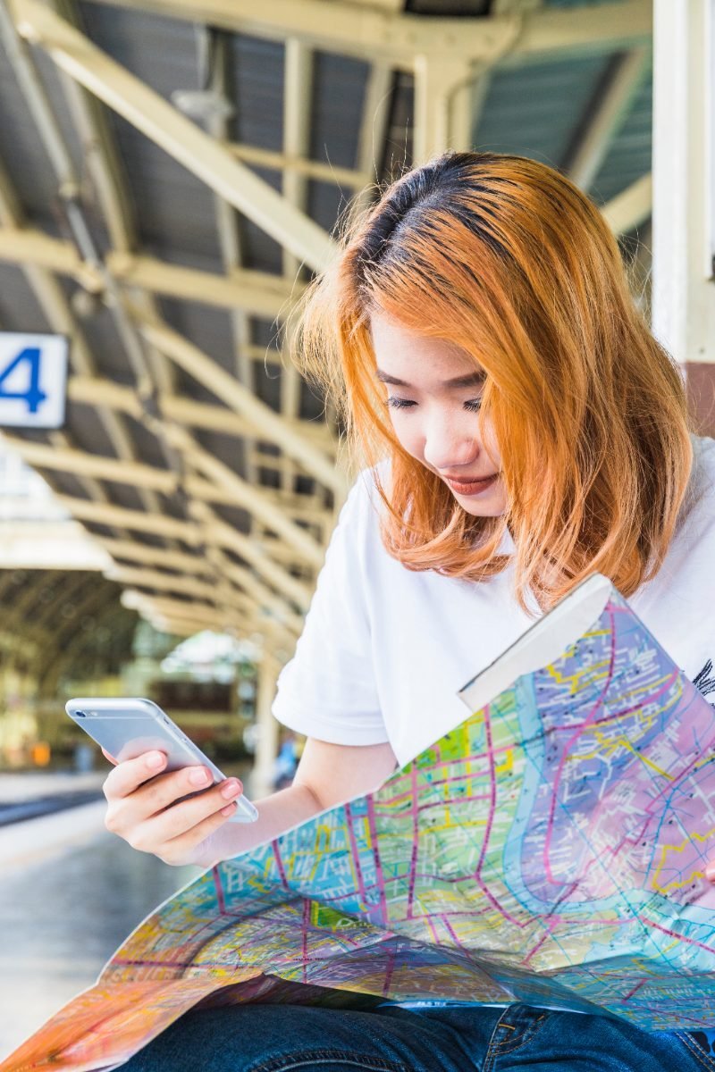 A solo traveler using a map app