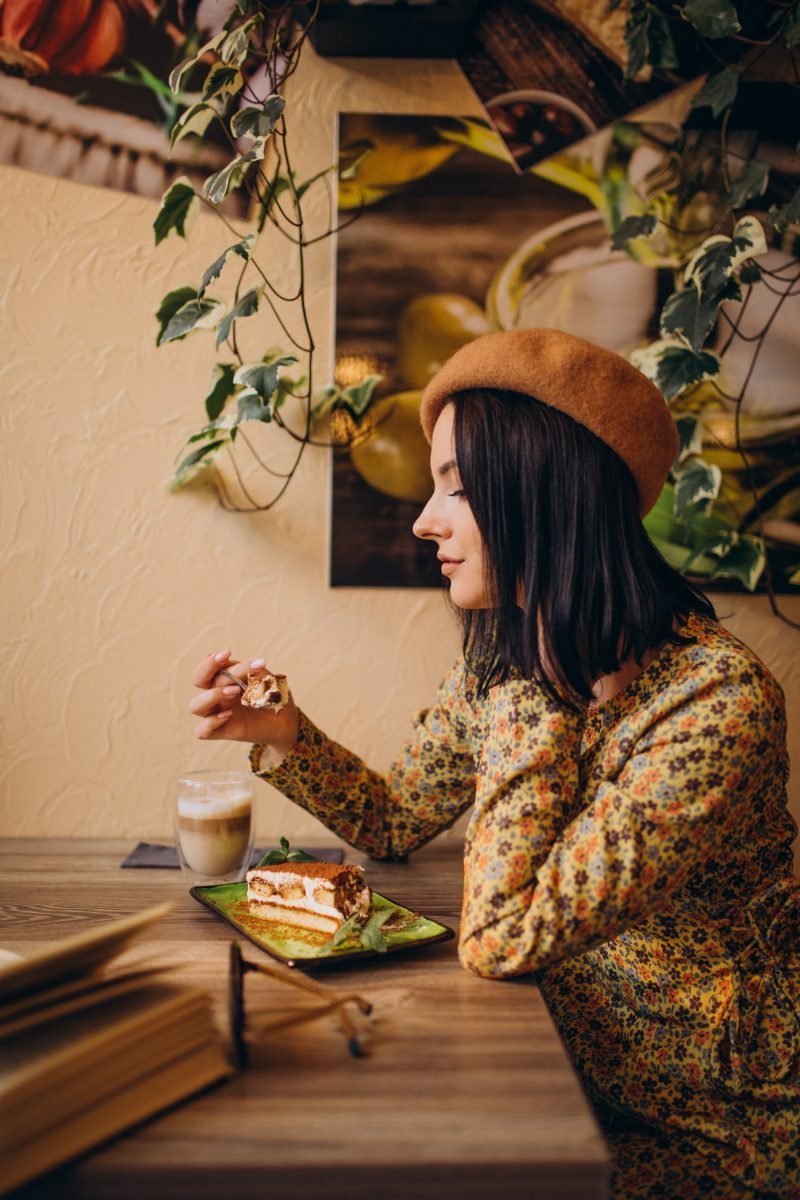 A solo traveler treating herself to dessert