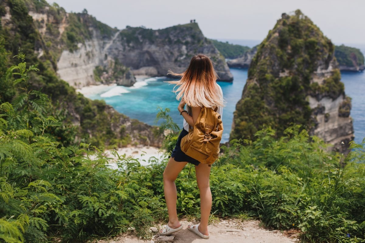 A solo traveler at a tropical beach