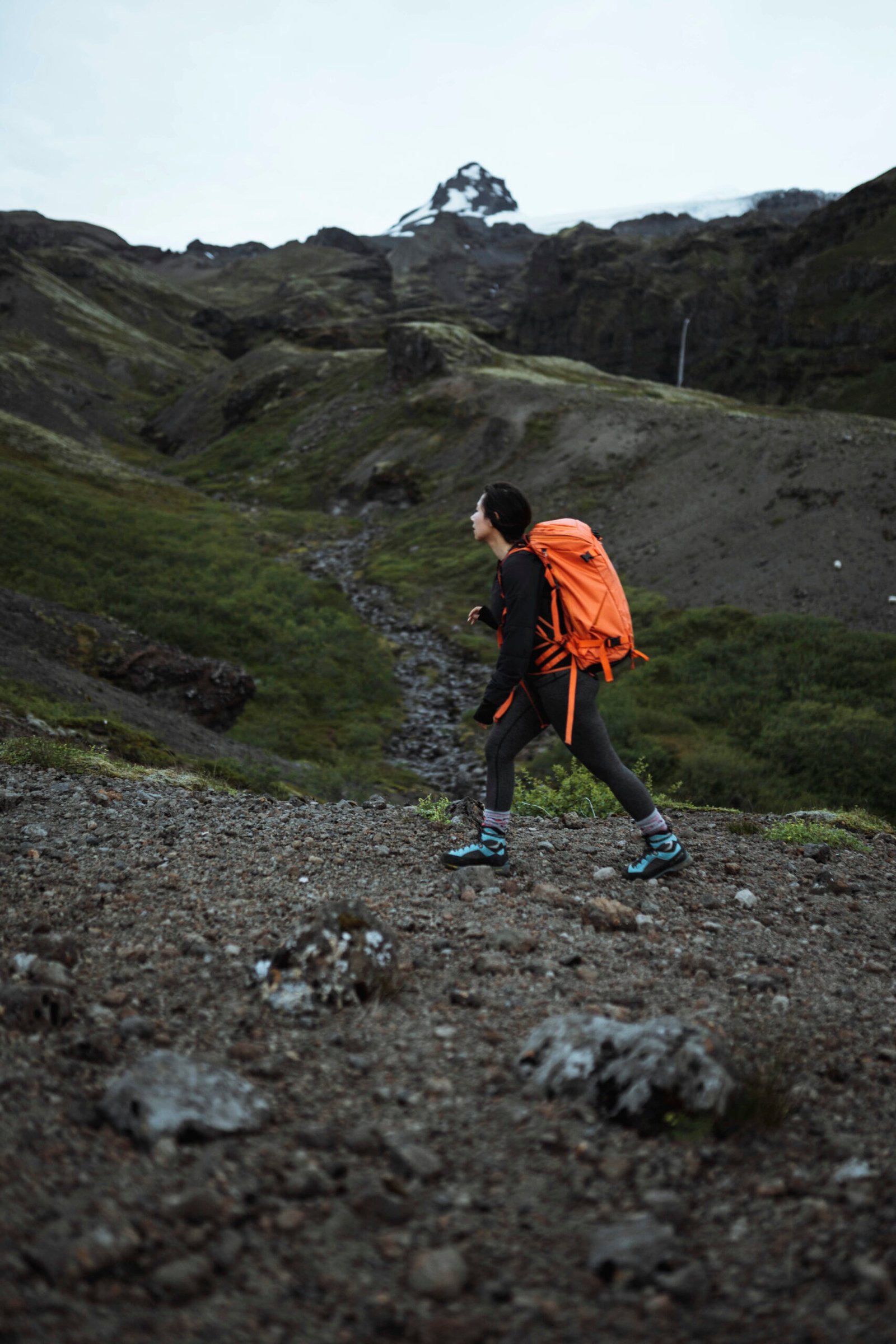Woman hiking alone along the south coast of Iceland