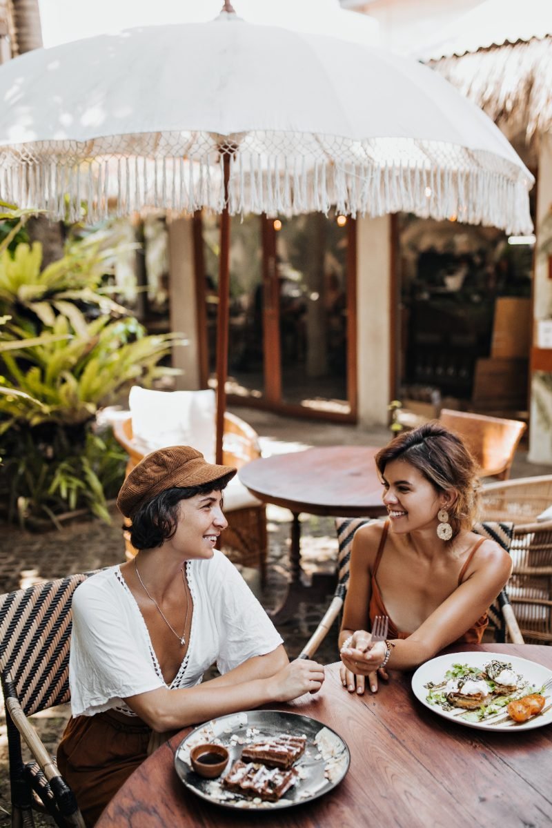 Friends talking at a street cafe
