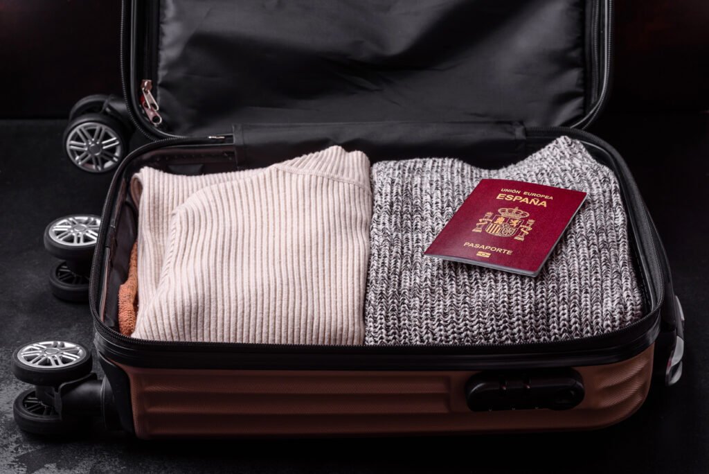 International passport of a citizen of Spain resting on a suitcase