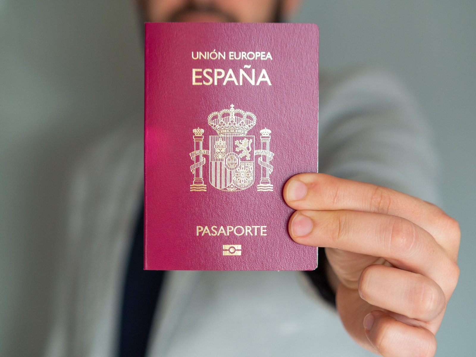 Man holding his Spanish European Union passport