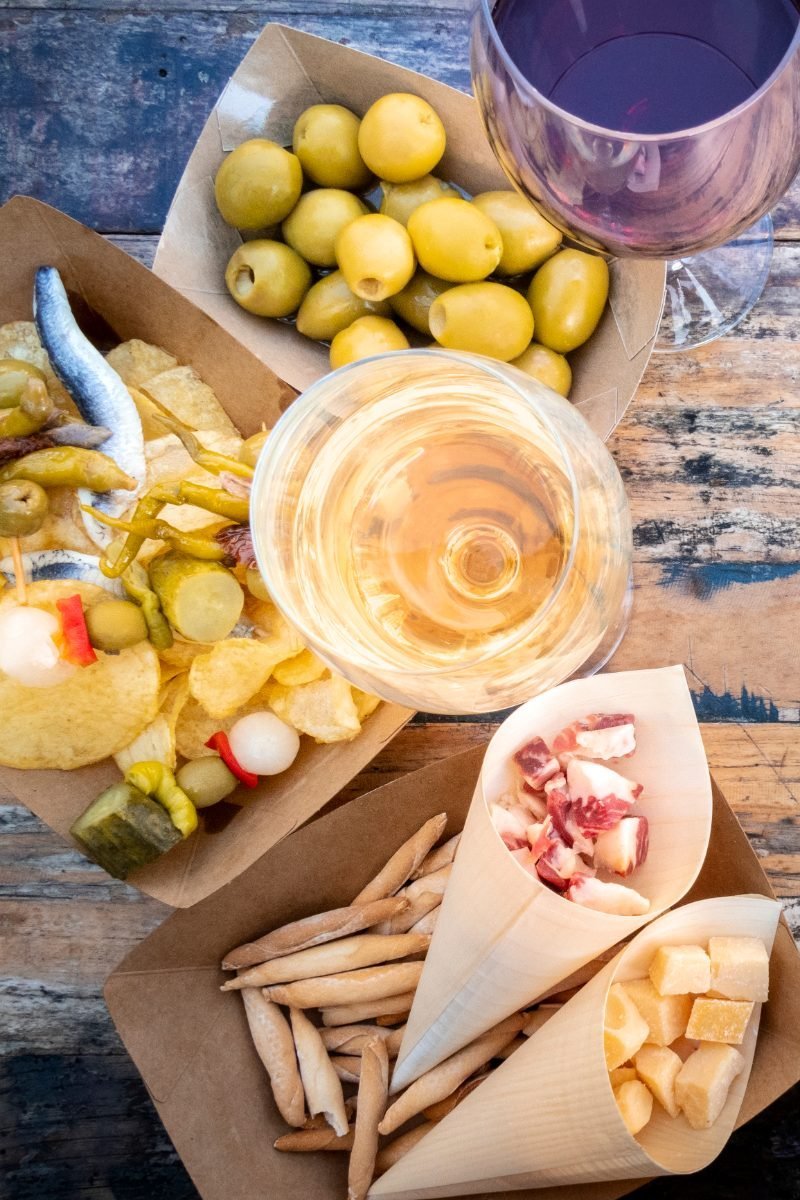 Spanish tapas and pinchos with wine at an outdoor cafe