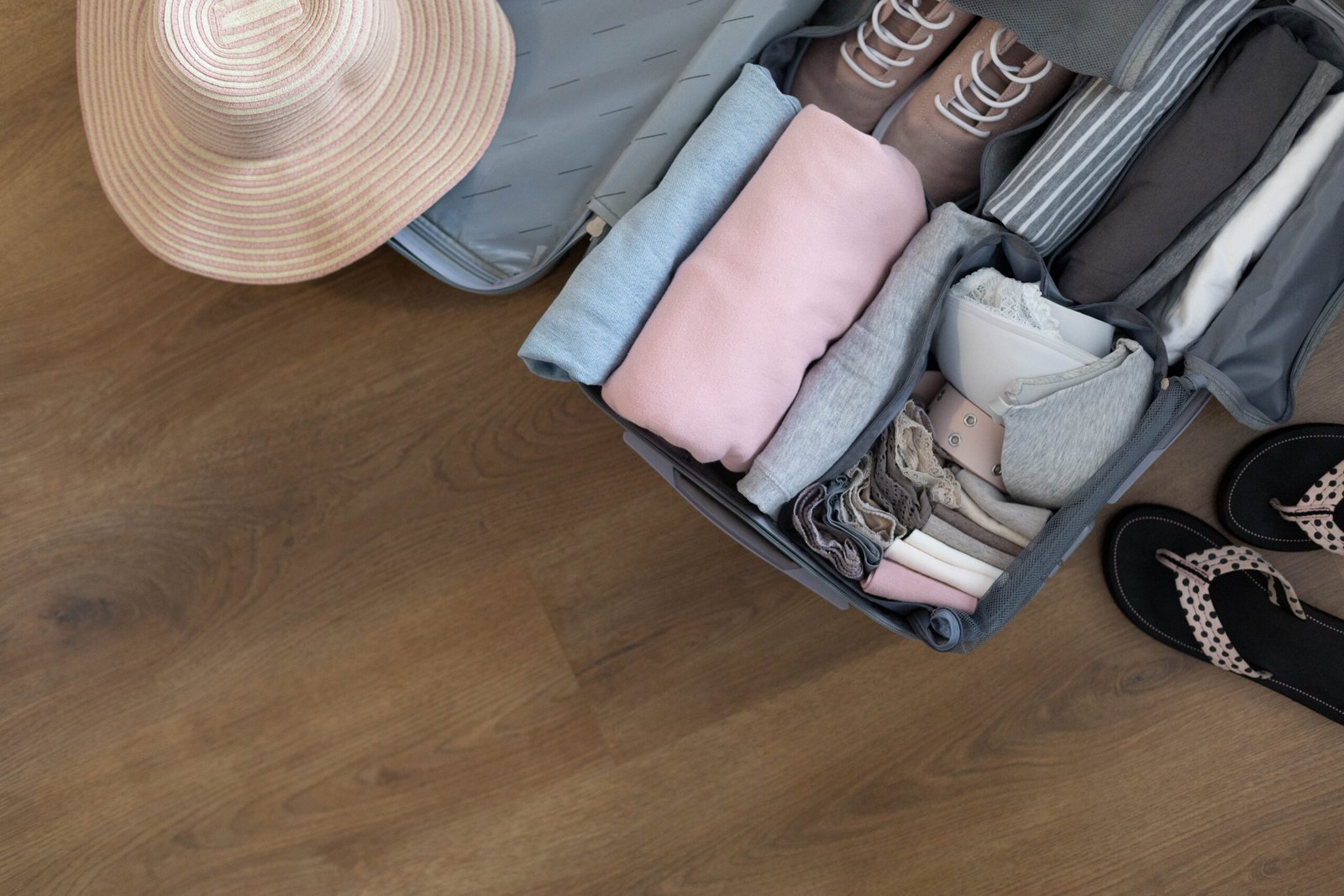 Top view of a suitcase showing organized packing with folded clothing