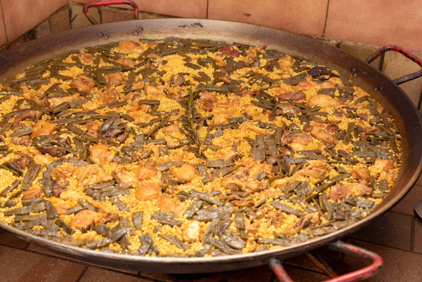 Traditional Paella Valenciana, a chicken and rabbit rice dish from Valencia