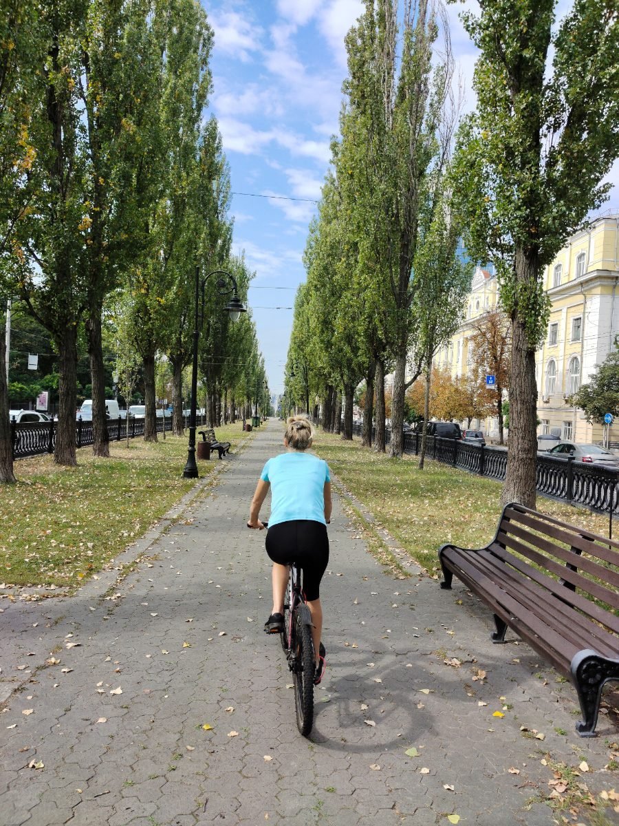 Cycling along a city park path