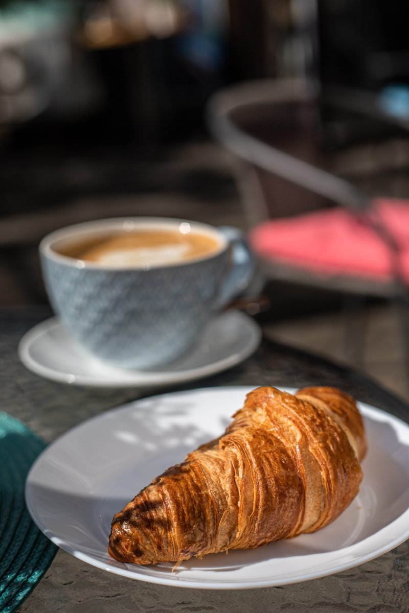 Coffee and a pastry at a cafe
