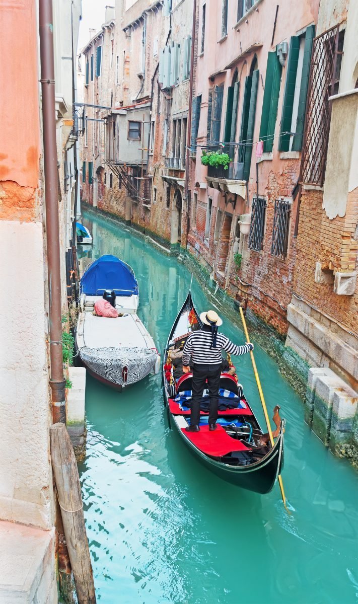 Gondola in a narrow Venice canal