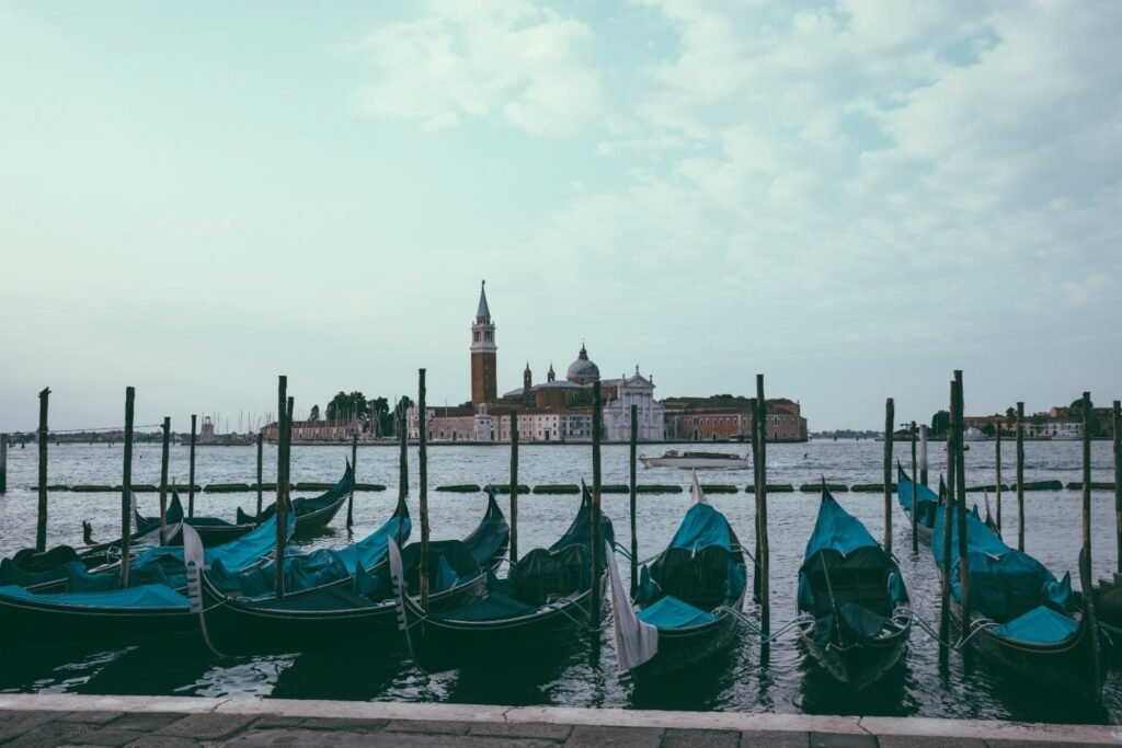 Panoramic view of Venice lagoon with gondolas and San Giorgio Maggiore