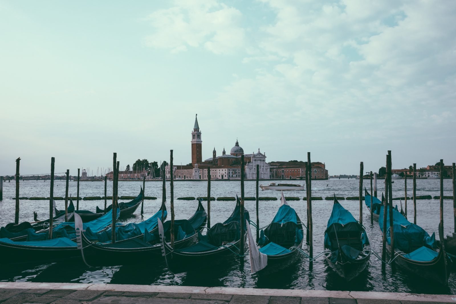 Panoramic view of Venice lagoon with gondolas and San Giorgio Maggiore