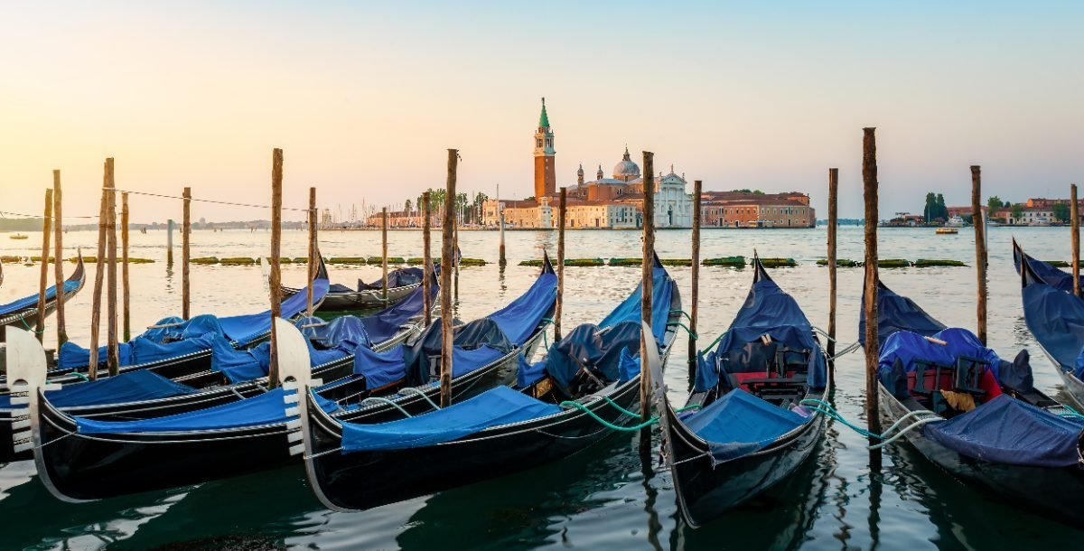 Moored gondolas at sunrise in front of San Giorgio Maggiore, Venice