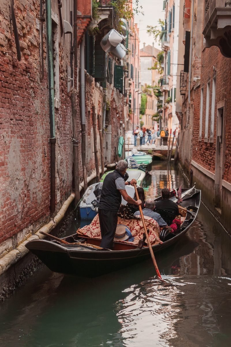 A tranquil Venice canal with a solitary gondola