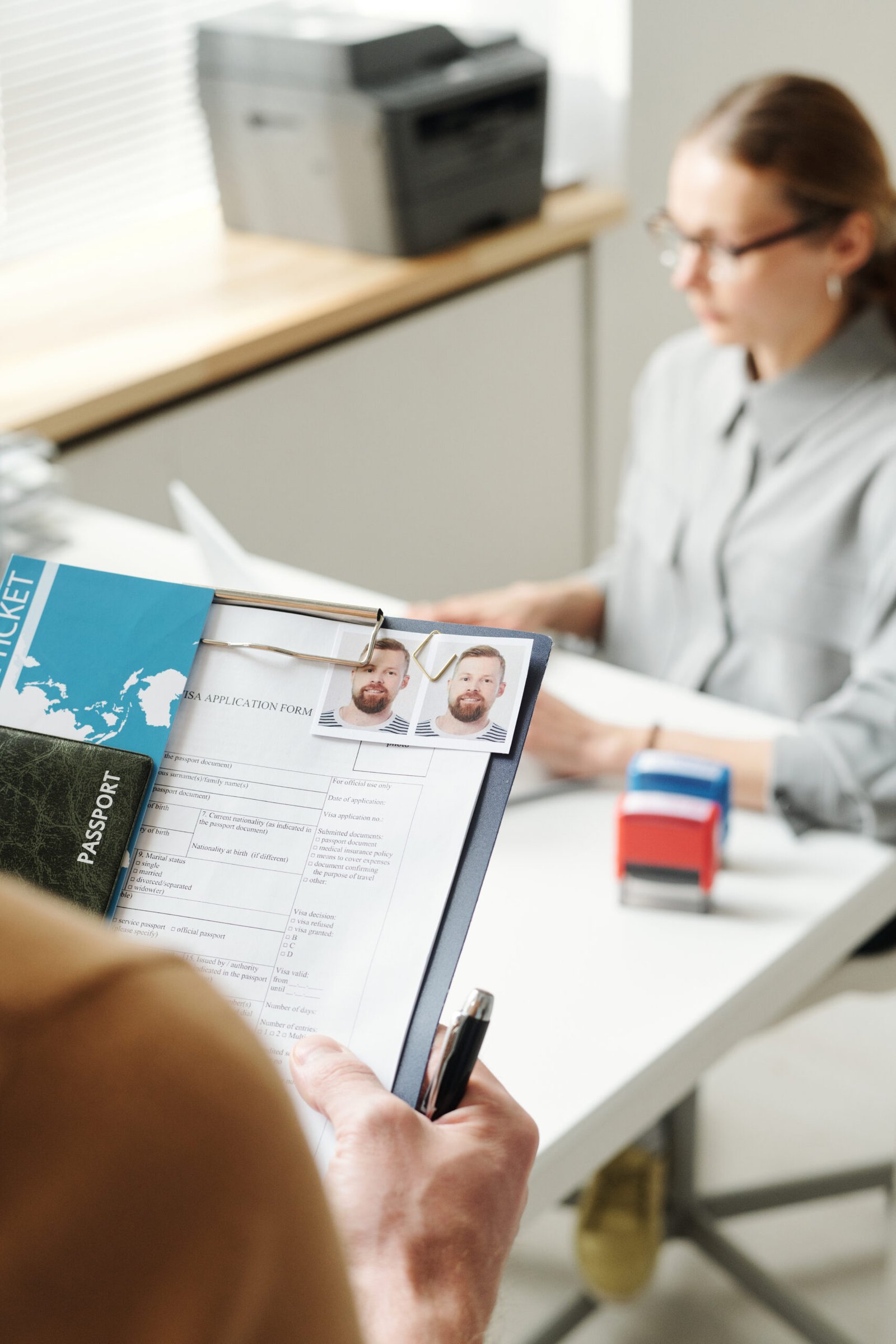 Man holding visa application documents