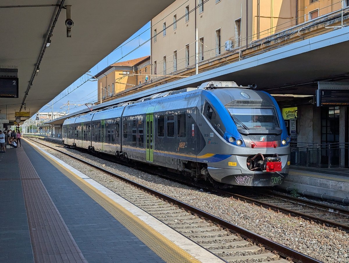 A regional train at an Italian station platform