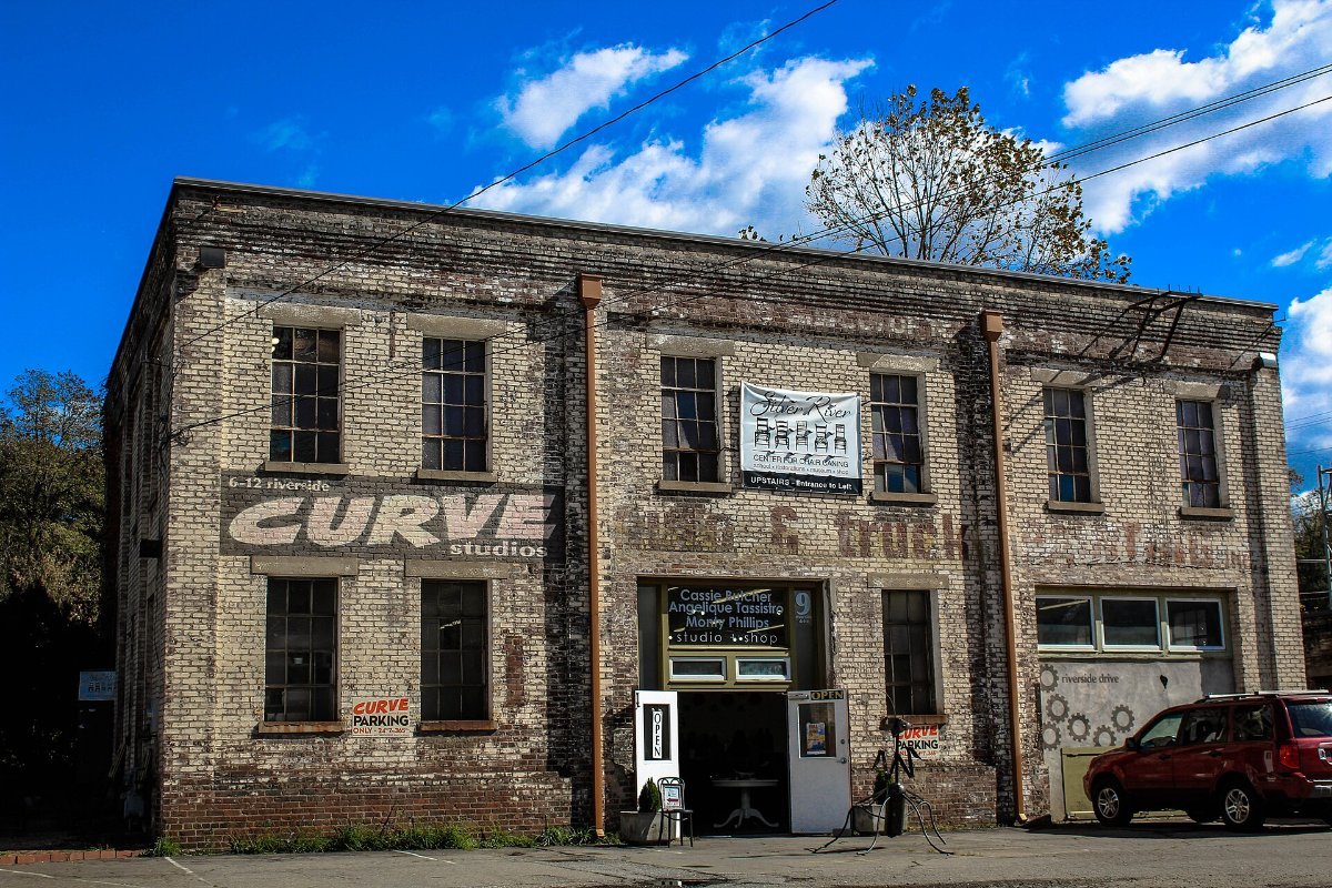 Murals and old warehouses in the River Arts District