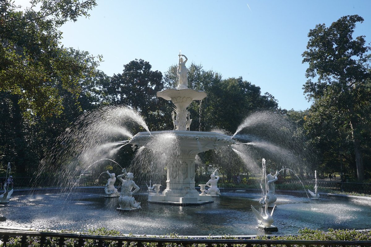 The white fountain and oak-lined paths of Forsyth Park in Savannah