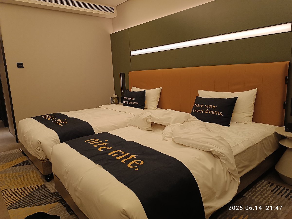 A quiet hotel room with a made bed