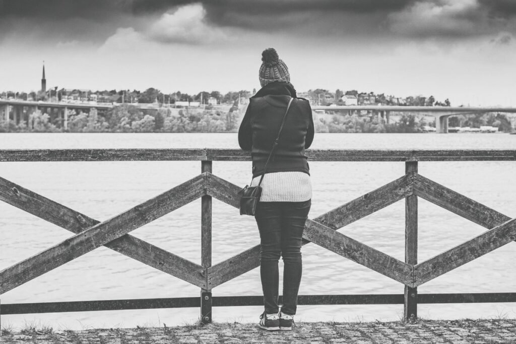 A solo traveller looking out over a view