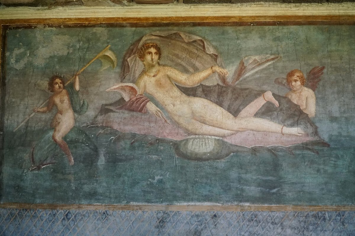 A frescoed wall inside a house at Pompeii