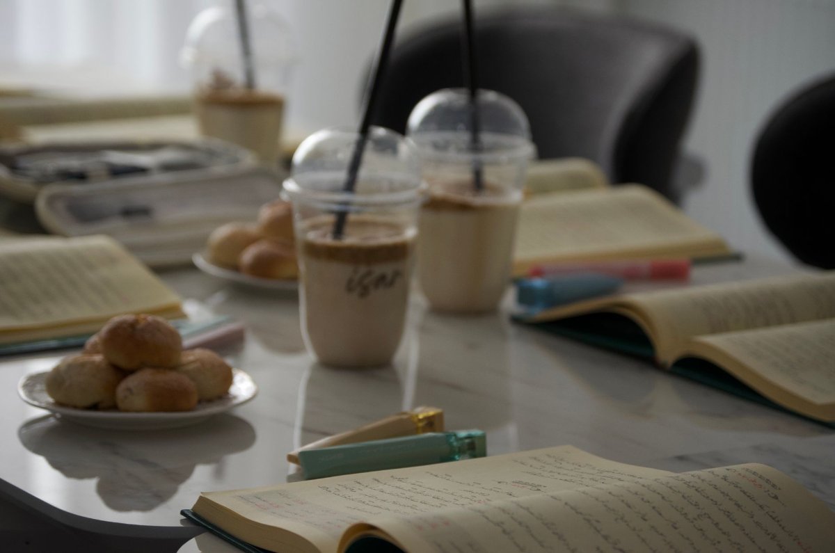 A quiet cafe table with a notebook and coffee