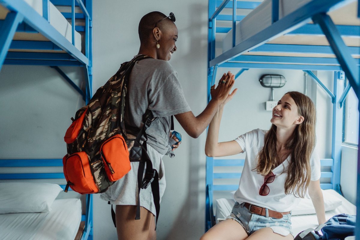 A hostel common room, where most solo trips find their people