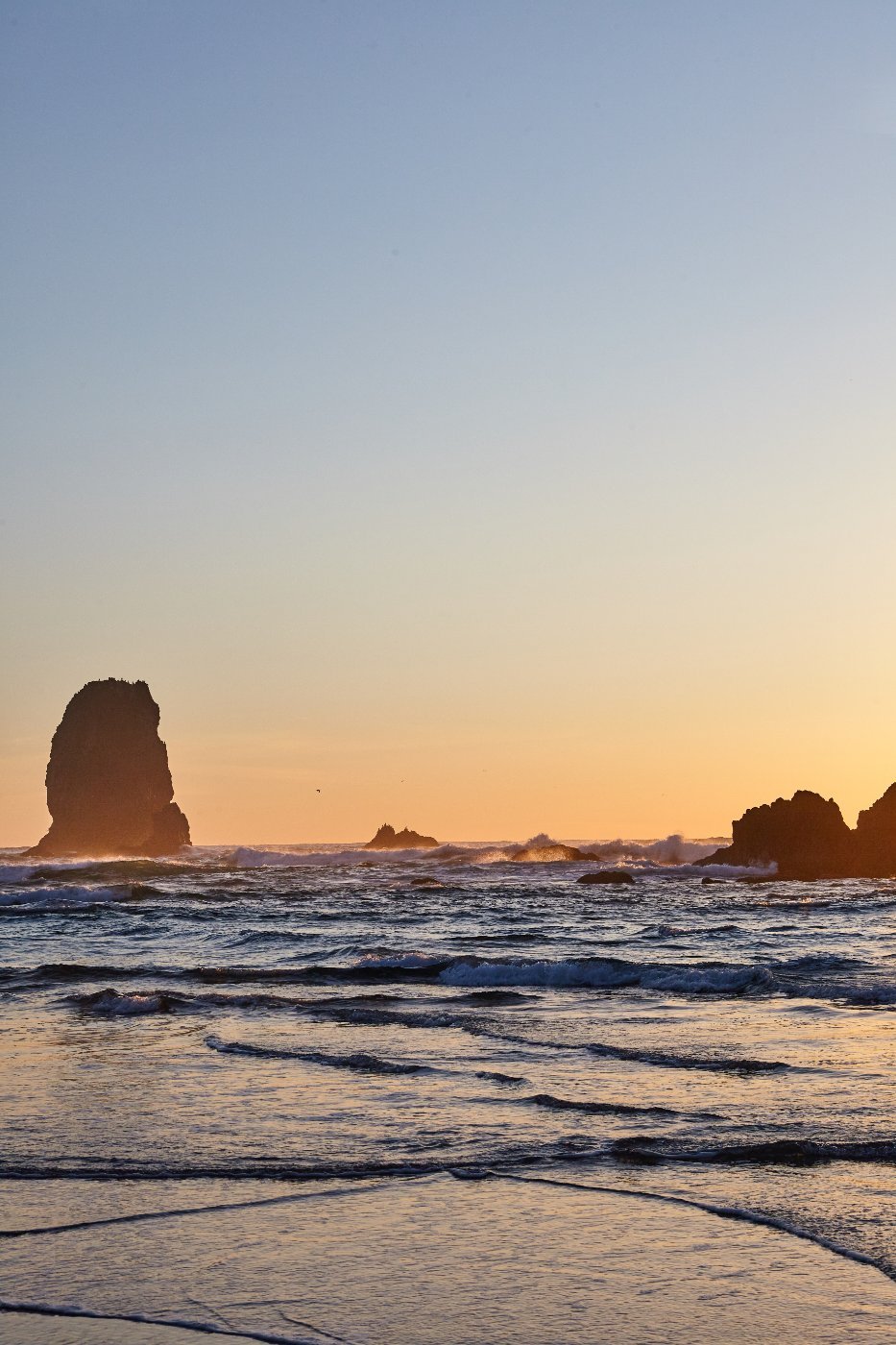 Haystack Rock standing off the shoreline at Cannon Beach