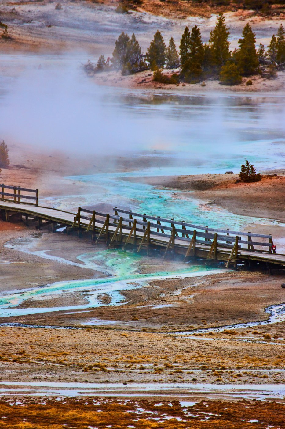 Acidic blue water beneath the boardwalk at Norris Basin