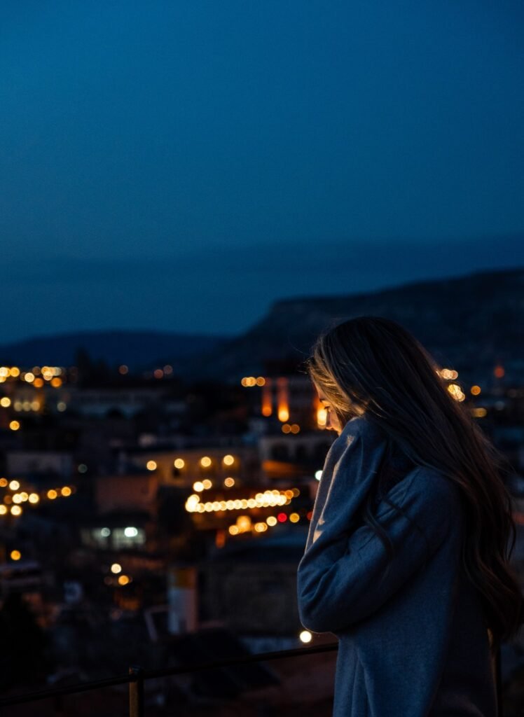 Looking down over a town's lights on a first evening