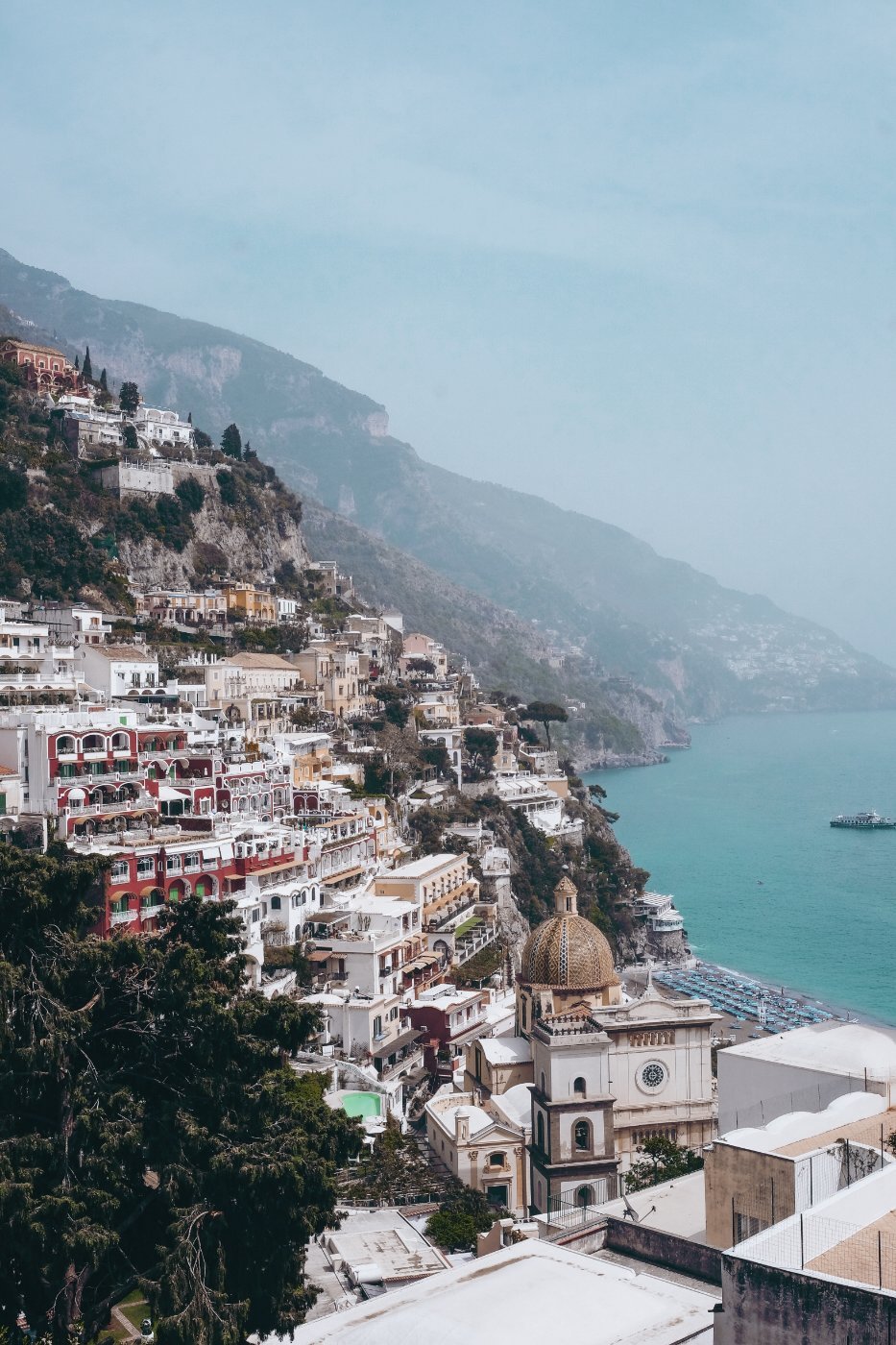 Positano stacked up the cliff above its beach