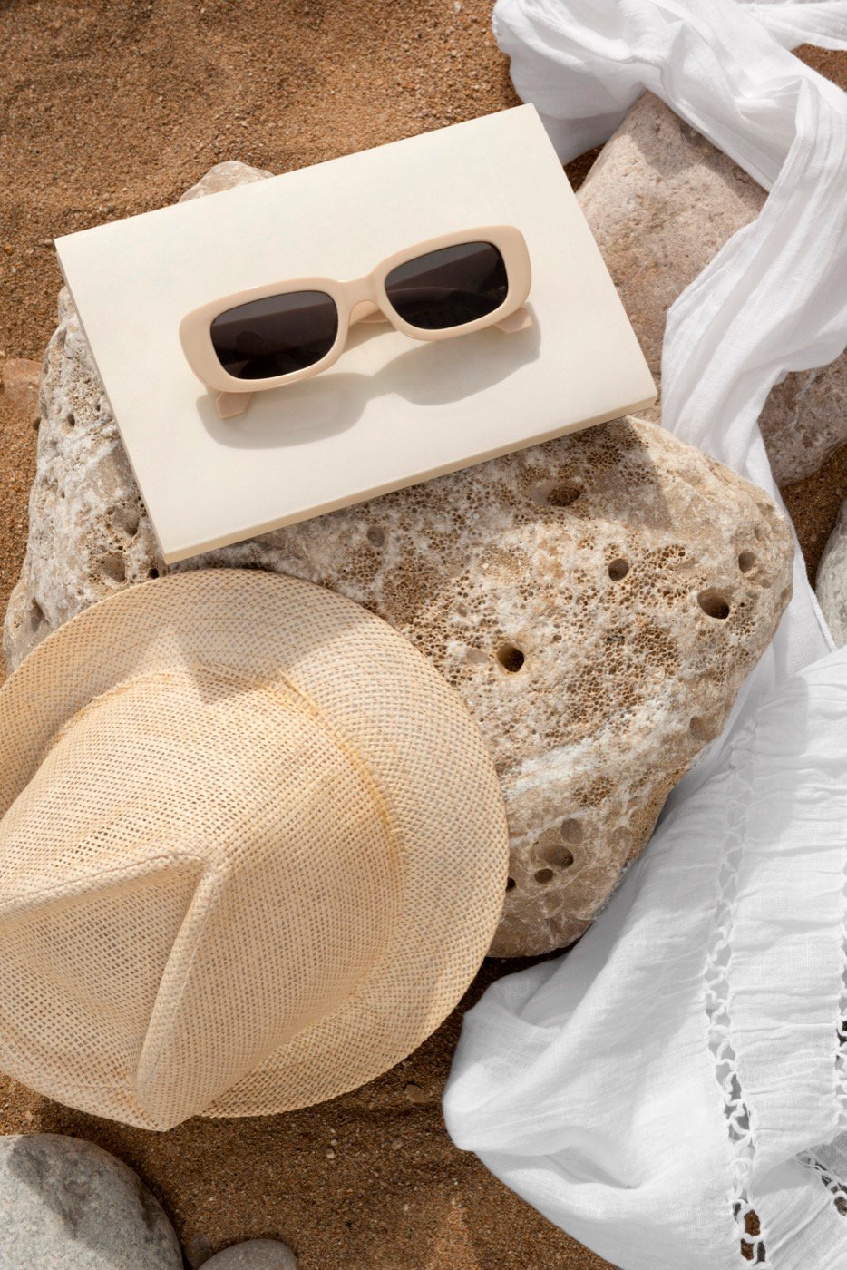 A beach bag packed with essentials, seen from above