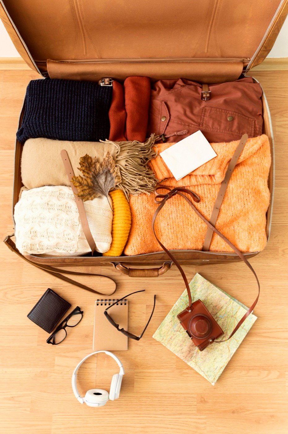 Travel essentials laid out from above before packing