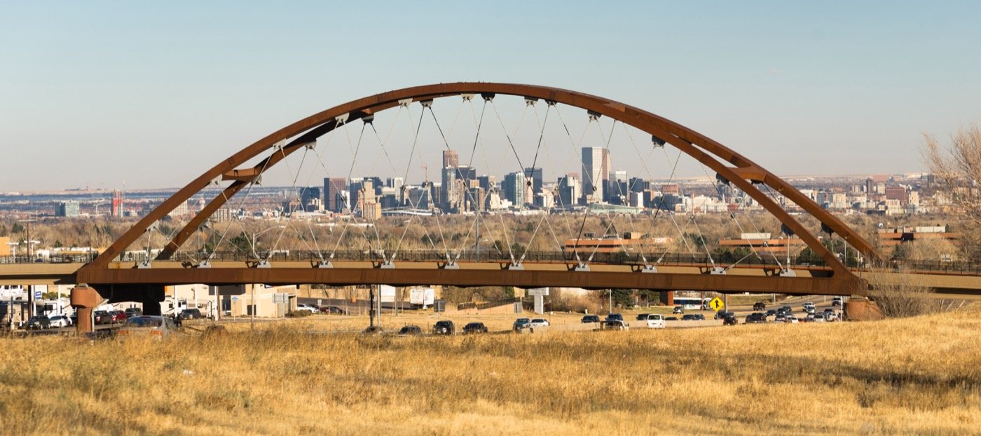 The transit bridge and Denver skyline